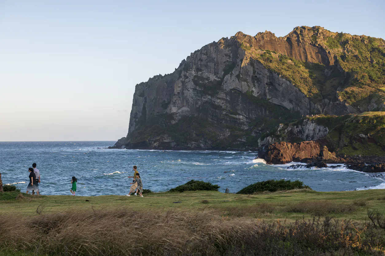 Korean family visiting Seongsan Ilchulbong on Jeju Island